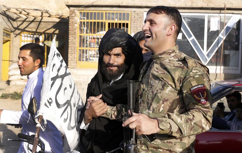 Alleged Taliban militants greet Afghan Army soldiers as a group of Taliban visits  people as a goodwill gesture amid a three-day ceasefire on second day of Eid al-Fitr, in Kabul, Afghanistan, on June 16, 2018. Hedayatullah Amid / EPA