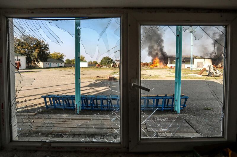 A fire burns at a factory following shelling during fighting over the separatist region of Nagorno-Karabakh. AP