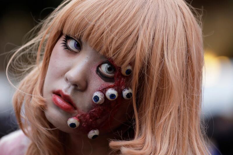 A participant in costume poses for a photo during a Halloween event in Kawasaki. EPA