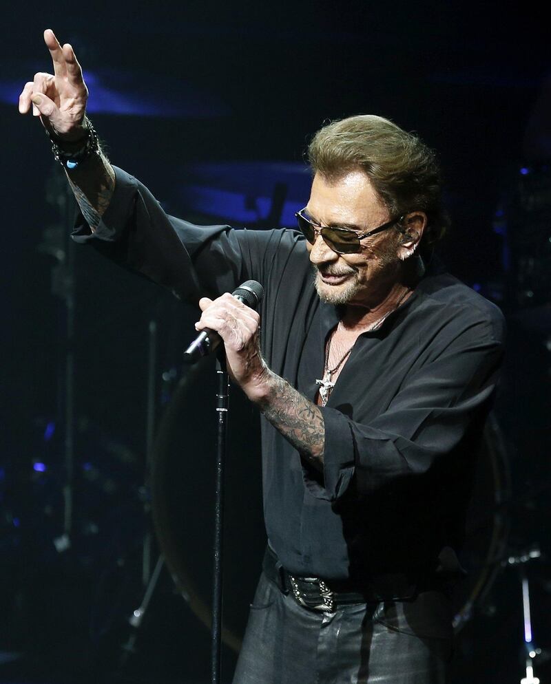 epa06370488 (FILE) A file picture dated 08 March 2016 shows French singer Johnny Hallyday perfoming during a concert held at the Liceo Great Theatre in Barcelona, Spain (reissued 06 December 2017). According to reports on 06 December 2017, French singer and actor Johnny Hallyday died at the age of 74.  EPA/ANDREU DALMAU