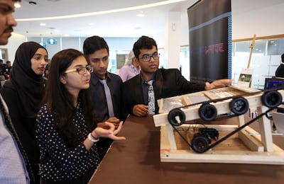 DUBAI , UNITED ARAB EMIRATES – April 26 , 2016 : Left to Right - Mahnoor Irfan , Muskaan Fatnani ,  Akshar Patel and Calvin Francis of year 10 from The Winchester School , Jebel Ali explaining about the Thermalator ( Automated Thermal Regulating System ) during the Arab Innovation Centre for Education event held at GEMS Wellington Academy , Silicon Oasis in Dubai. ( Pawan Singh / The National ) For News. Story by Nadeem Hanif.  ID No : 82141 *** Local Caption ***  PS2604- AICE05.jpg