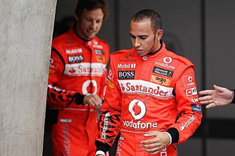 Jenson Button, left, and Lewis Hamilton, the McLaren-Mercedes drivers, have both finished second in races this season, but neither man has been able to beat Sebastian Vettel, the world champion, in his Red Bull Racing car, in 2011.