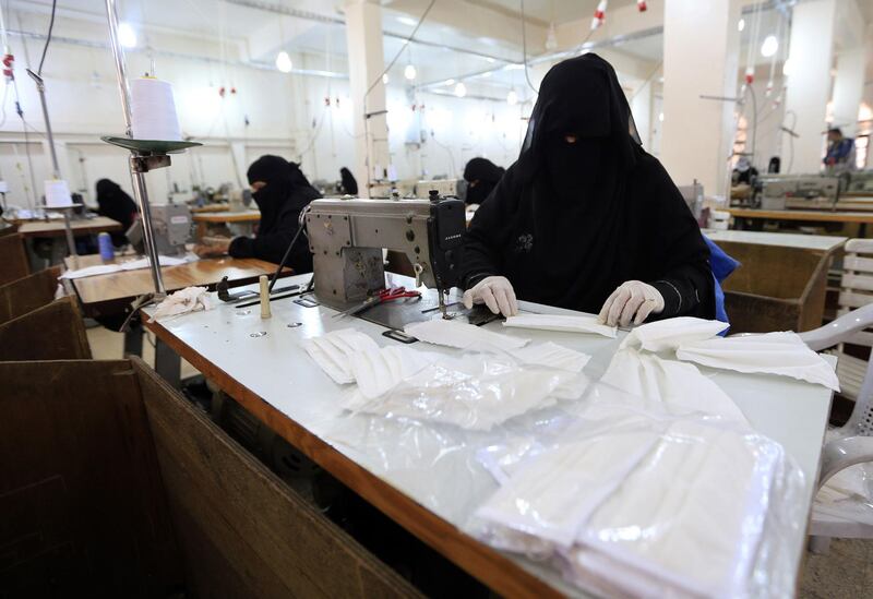Yemeni women make face masks at a textile factory in the capital Sanaa. AFP