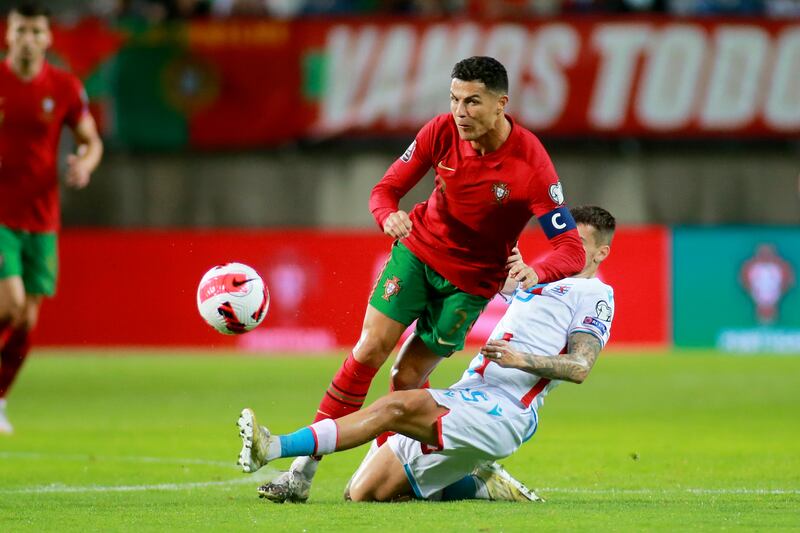 Luxembourg's Olivier Thill tackles Portugal's Cristiano Ronaldo. AP