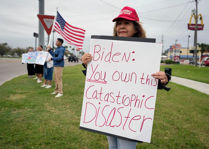 Lydia Munoz, of Brownsville, protests before Mr Biden's arrival. AP