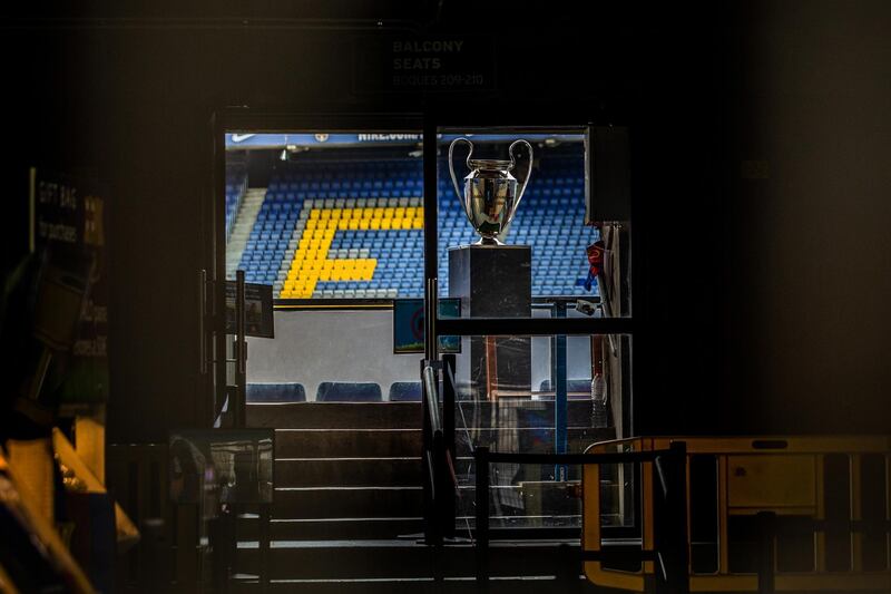 Empty seats and a trophy sit inside the Camp Nou stadium. Bloomberg