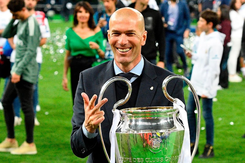 Zidane with his third Champions League title after Real Madrid beat Liverpool in Kiev in 2018. Genya Savilov / AFP