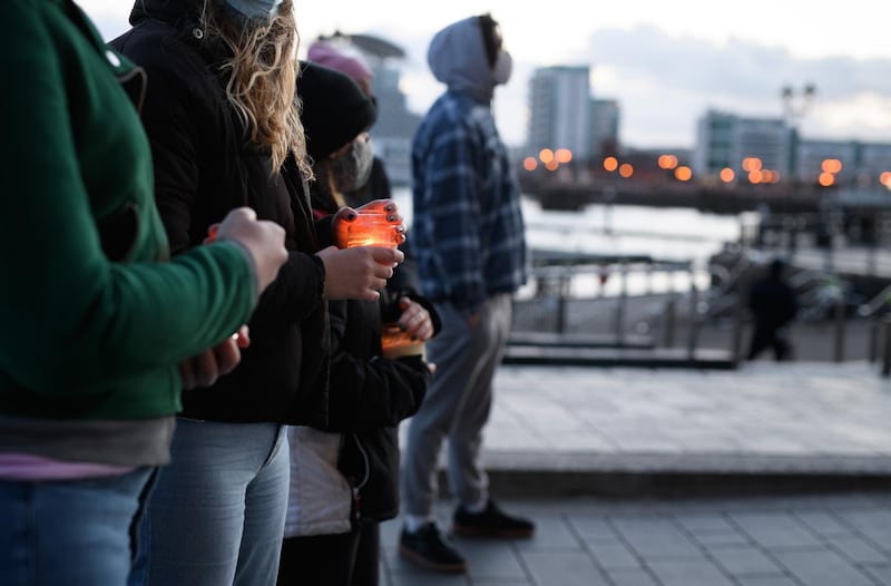 People hold lit candles during a vigil held in memory of Sarah Everard in Cardiff, Wales. Getty Images