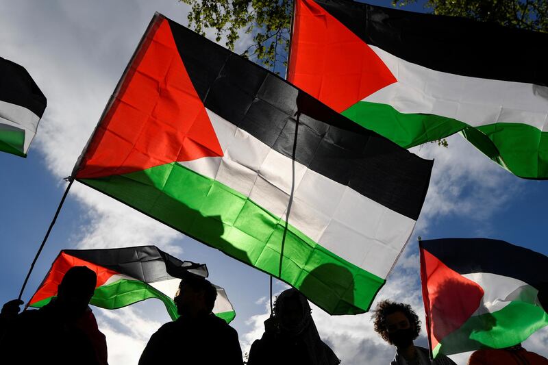 Palestinian flags are waved in London. Reuters