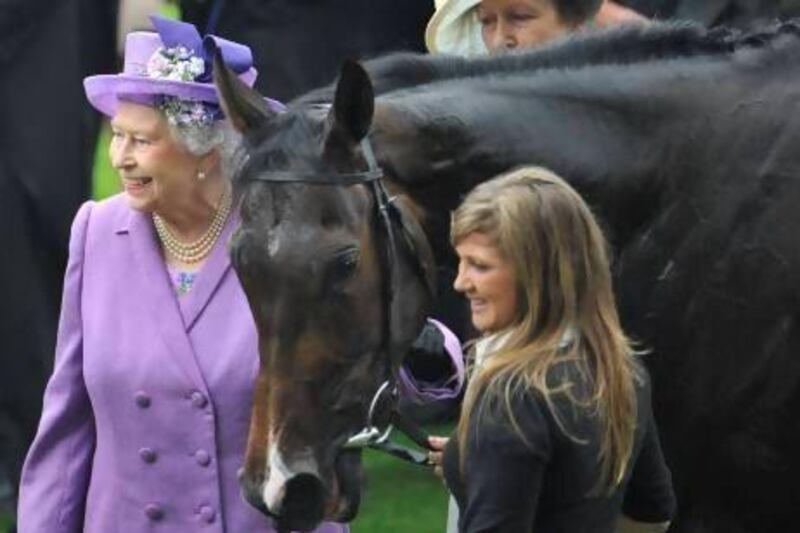 Britain's Queen Elizabeth, left, with her horse Estimate.