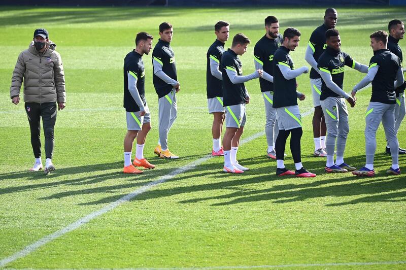 Atletico manager Diego Simeone oversees training. AFP