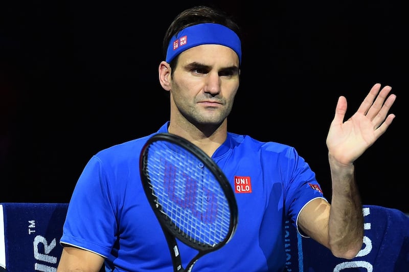 Switzerland's Roger Federer sits in the break between games against Austria's Dominic Thiem during their men's singles round-robin match on day three of the ATP World Tour Finals tennis tournament at the O2 Arena in London on November 13, 2018.  / AFP / Glyn KIRK                  
