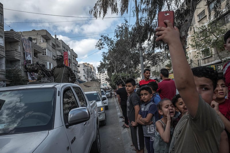 Fighters of Ezz al-Din Al-Qassam brigades, the military wing of Hamas, march in greeting to the Al Qassam commanders in Gaza Basim Issa in Gaza City in Gaza City, Gaza. The ceasefire between Israel and Hamas appeared to be holding, despite fresh clashes at Al-Aqsa Mosque in East Jerusalem. The ceasefire brings to an end eleven days of fighting which killed more than 250 Palestinians, many of them women and children, and 13 Israelis. The conflict began on May 10th after rising tensions in East Jerusalem and clashes at the Al Aqsa Mosque compound. Getty Images