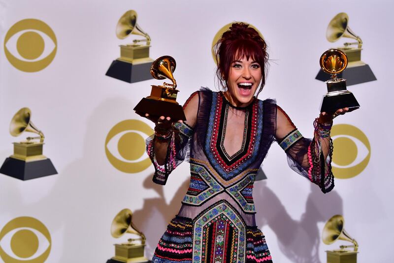 Lauren Daigle poses with her two Grammys  in the press room. AFP