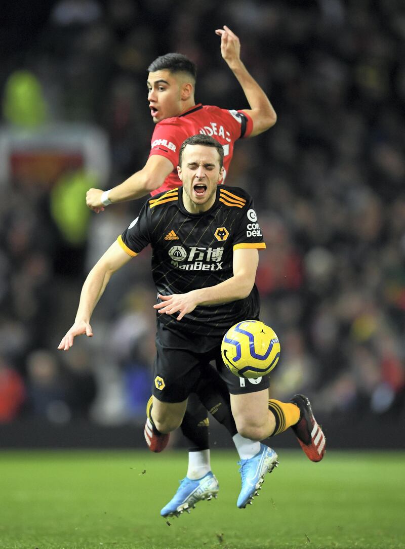 MANCHESTER, ENGLAND - FEBRUARY 01: Diogo Jota of Wolverhampton Wanderers is challenged by Andreas Pereira of Manchester United during the Premier League match between Manchester United and Wolverhampton Wanderers at Old Trafford on February 01, 2020 in Manchester, United Kingdom. (Photo by Clive Mason/Getty Images)