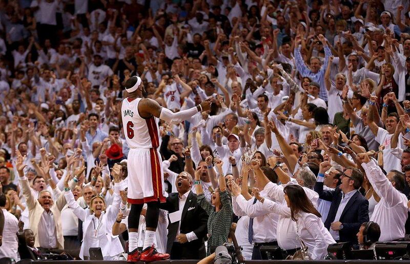 leBron James reacts to the crowd after the Miami Heat win Game 5 against the Brooklyn Nets on Wednesday to advance to the Eastern Conference finals. Mike Ehrmann / Getty Images / AFP / May 14, 2014