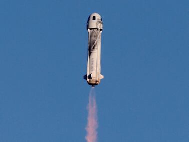 A Blue Origin New Shepard rocket lifts off with a crew of six in December, 2021.  Reuters
