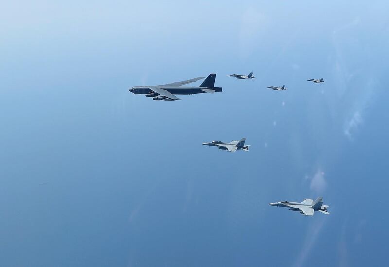 The Abraham Lincoln Carrier Strike Group and a US Air Force B-52H Stratofortress, assigned to the 20th Expeditionary Bomb Squadron and part of the Bomber Task Force deployed to the region, conducting joint exercises in the US Central Command area of responsibility, in the Arabian Sea. EPA