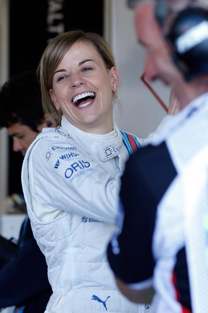 British driver Susie Wolff of Williams smiles during the first practice session of the British Formula One Grand Prix at Silverstone in Northamptonshire, Britain, on July 4, 2014. Valdrin Xhemaj / EPA