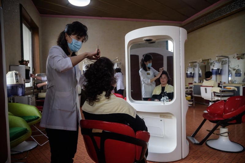 In a photo taken on November 15, 2020 customers recieve beauty treatments at the Changgwang Health Complex in Pyongyang. (Photo by KIM Won Jin / AFP)