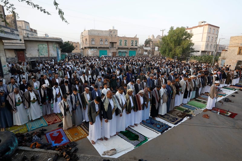 People attend Eid al-Fitr prayers outside a mosque in Sana'a, Yemen. EPA