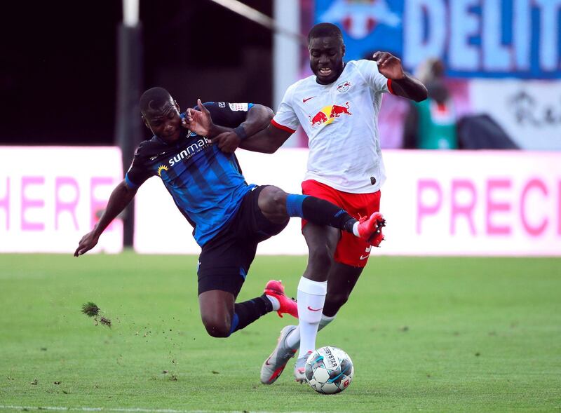 Leipzig defender Dayot Upamecano is challenged by Streli Mamba of Paderborn. AFP