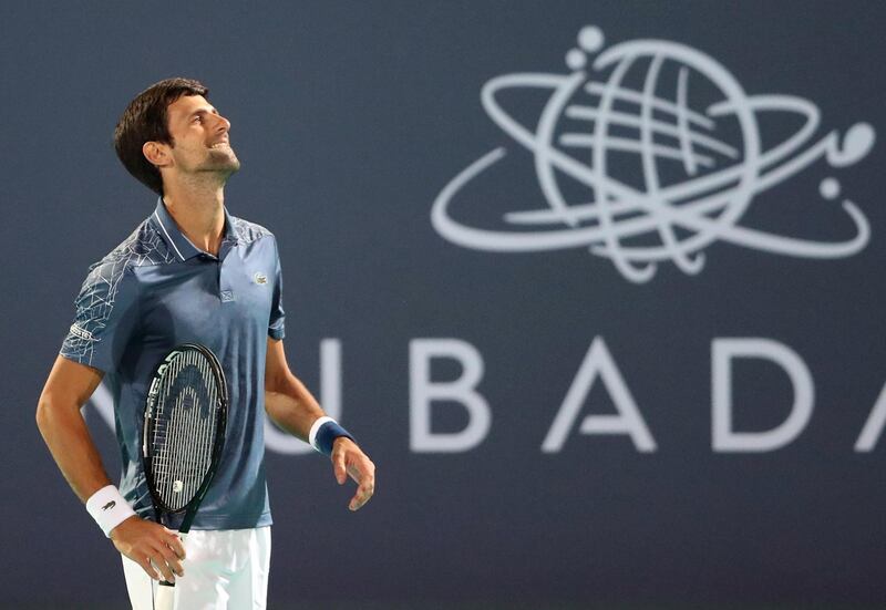 Novak Djokovic grimaces after winning the first set 6-4. Reuters