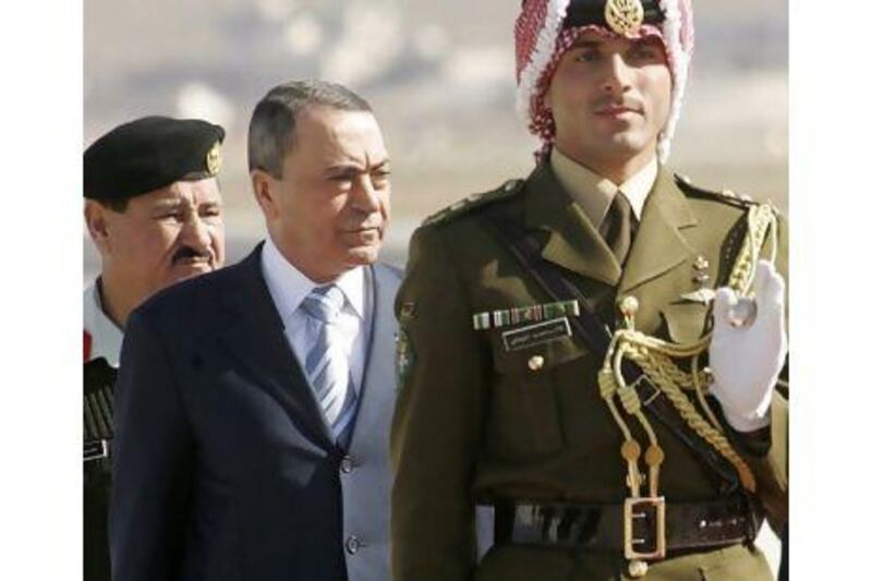 The new Jordanian prime minister, Marouf Bakhit, centre, held the post in the past.
