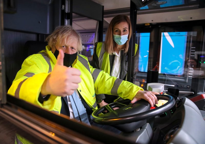 Mr Johnson gives a thumbs-up during a visit to the National Express depot in Coventry on March 15. The prime minister was unveiling a shake-up of the bus sector which aims to see lower, simpler flat fares in towns and cities.