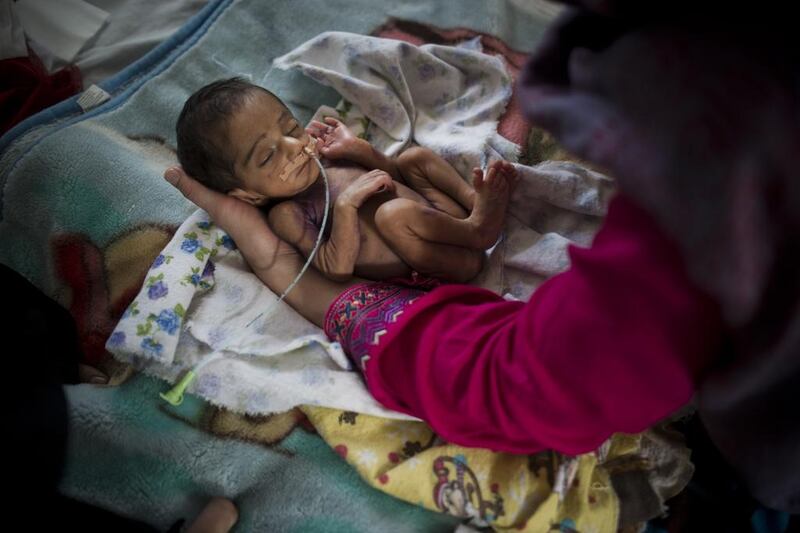 Pediatric nurse Isabelle Arnould examines a baby in the neonatal ward at the MSF Maternity Hospital in Khost, Afghanistan. Andrea Bruce/ Noor Images 