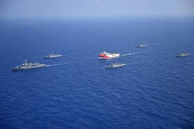 This handout photograph released by the Turkish Defence Ministry on August 12, 2020, shows Turkish seismic research vessel 'Oruc Reis' (C) as it is escorted by Turkish Naval ships in the Mediterranean Sea, off Antalya on August 10, 2020.  Greece on August 11, demanded that Turkey withdraw a research ship at the heart of their growing dispute over maritime rights and warned it would defend its sovereignty, calling for an emergency meeting of EU foreign ministers to resolve the crisis. Tensions were stoked August 10, when Ankara dispatched the research ship Oruc Reis accompanied by Turkish naval vessels off the Greek island of Kastellorizo in the eastern Mediterranean.
 - RESTRICTED TO EDITORIAL USE - MANDATORY CREDIT "AFP PHOTO /TURKISH DEFENCE MINISTRY " - NO MARKETING - NO ADVERTISING CAMPAIGNS - DISTRIBUTED AS A SERVICE TO CLIENTS
 / AFP / TURKISH DEFENCE MINISTRY / - / RESTRICTED TO EDITORIAL USE - MANDATORY CREDIT "AFP PHOTO /TURKISH DEFENCE MINISTRY " - NO MARKETING - NO ADVERTISING CAMPAIGNS - DISTRIBUTED AS A SERVICE TO CLIENTS
