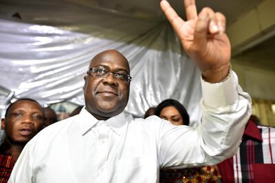 FILE PHOTO: Felix Tshisekedi, leader of the Congolese main opposition party, the Union for Democracy and Social Progress, gestures to supporters at party headquarters in Kinshasa, Democratic Republic of Congo, January 10, 2019. REUTERS/Olivia Acland/File Photo