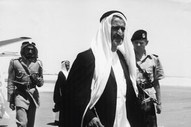 Sheikh Rashid bin Saeed Al Maktoum, with Chief of Police John Briggs behind him, at Dubai Airport, circa 1960. (Photo by Keystone Features/Hulton Archive/Getty Images)