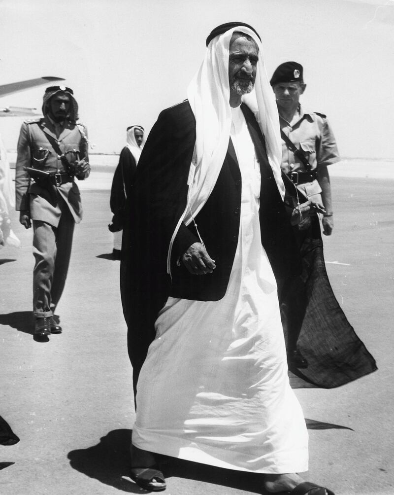 Sheikh Rashid bin Saeed Al Maktoum, with Chief of Police John Briggs behind him, at Dubai Airport, circa 1960. (Photo by Keystone Features/Hulton Archive/Getty Images)