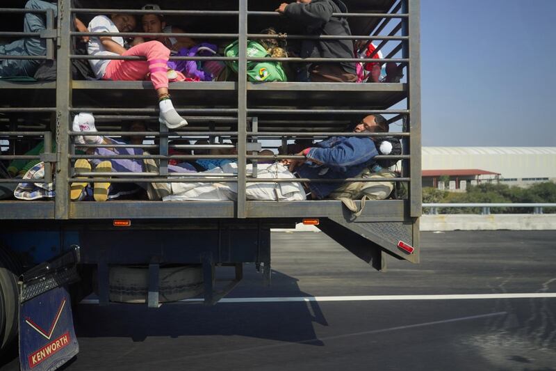 Migrants  travel inside a chicken truck as they make they way to Irapuato from Queretaro, Mexico. Reuters