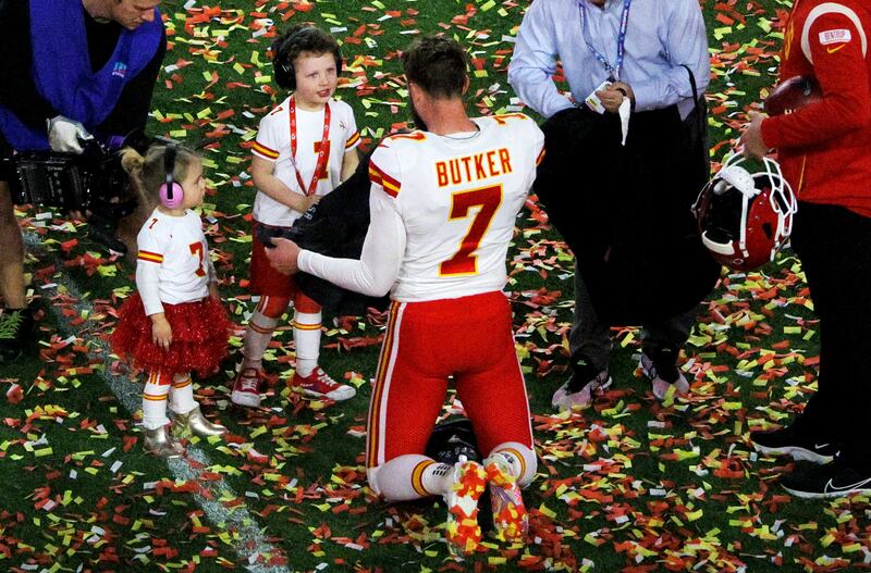 Kansas City Chiefs' Harrison Butker celebrates winning Super Bowl LVII with his kids. Reuters