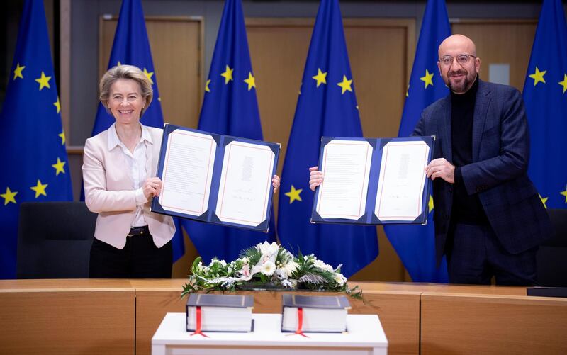 BRUSSELS, BELGIUM - DECEMBER 30: President of the European Commission Ursula von der Leyen (L) and the President of the European Council Charles Michel (R) attend a Brexit signature ceremony in the Europa building, the EU Council headquarters on December 30, 2020 in Brussels, Belgium. The United Kingdom and the European Union agreed a Trade and Cooperation Agreement, an Agreement on Nuclear Cooperation and an Agreement on Security Procedures for Exchanging and Protecting Classified Information on Christmas Eve 2020.  These Agreements change the basis of the UK's relationship with the EU from EU law to free trade and friendly cooperation. In a referendum of 23 June 2016 the British people voted to take back control of their laws, borders, money, trade and fisheries, commonly referred to as Brexit. (Photo by Thierry Monasse/Getty Images)