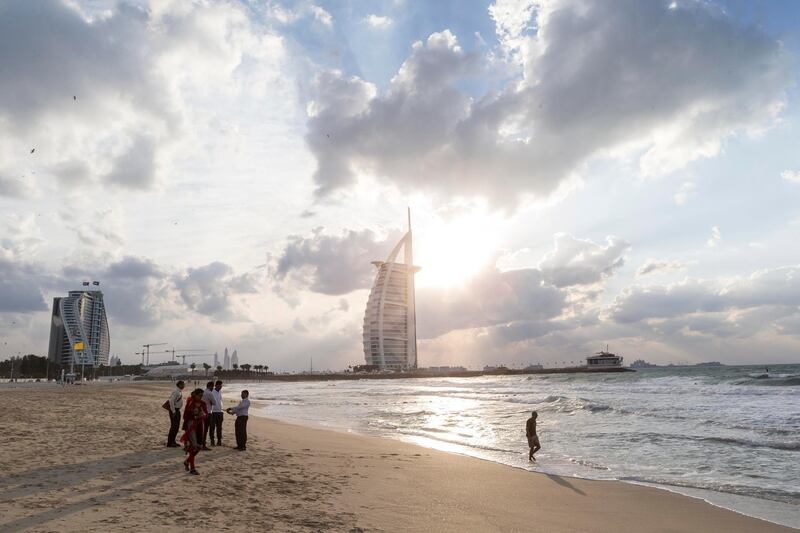 DUBAI, UNITED ARAB EMIRATES, 08 DECEMBER 2015. Visitors enjoy the windy weather on Sunset Beach in Dubai. STANDALONE (Photo: Antonie Robertson/The National) ID: None. Journalist: None. Section: National. *** Local Caption ***  AR_0812_Standalone-01.JPG