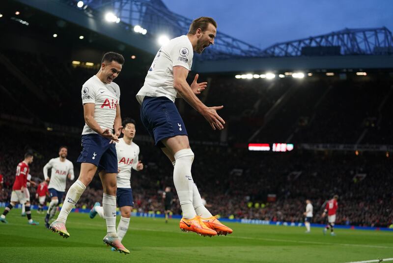 Harry Kane celebrates with Sergio Reguilon after scoring from the penalty spot. PA