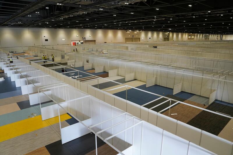 Contractors and members of the armed forces help to build the new NHS Nightingale Hospital. Courtesy: Reuters