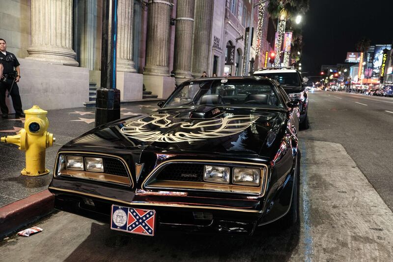 The Pontiac Firebird Trans Am from Burt Reynold's film "Smokey and the Bandit" is seen in front of Burt Reynold's star on the Hollywood Walk of Fame. AFP