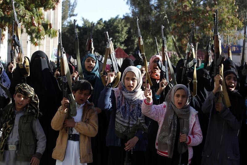 epa06436391 Pro-Houthi female supporters and children hold weapons during a gathering to show support to the Houthi rebels, in Sana’a, Yemen, 13 January 2018.   A United Nations panel has concluded that Iran violated an arms embargo imposed on Yemen by directly or indirectly providing missiles and drones to the Houthi rebels in the conflict-plagued Arab country.  EPA/YAHYA ARHAB