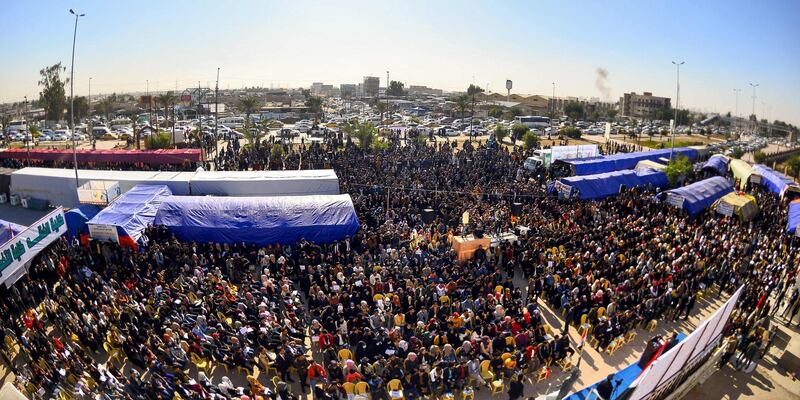 Protesters gather during an anti-government sit-in outside the gate of Kufa University in the holy Iraqi city of Najaf.  AFP