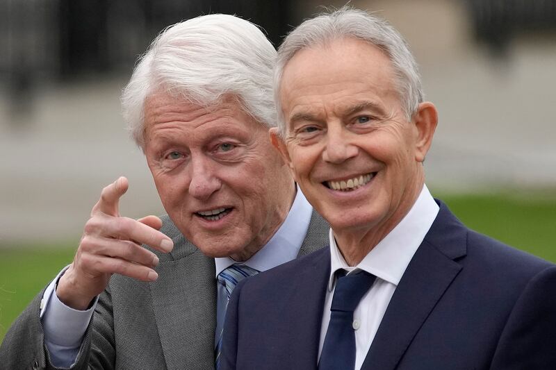 Former US president Bill Clinton stands beside Britain's former Prime Minister Tony Blair at Queen's University Belfast to mark the 25th anniversary of the Good Friday Agreement. AP