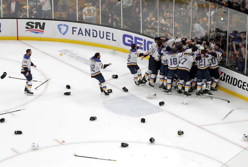 The St. Louis Blues celebrate their win over the Boston Bruins in Game 7 of the NHL hockey Stanley Cup Final in Boston. AP Photo