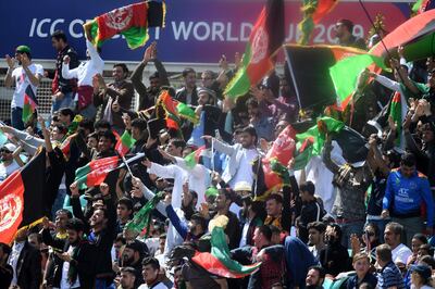 Afghanistan fans celebrate a boundary during the 2019 Cricket World Cup warm up match between England and Afghanistan at The Oval in London on May 27, 2019. / AFP / Dibyangshu SARKAR
