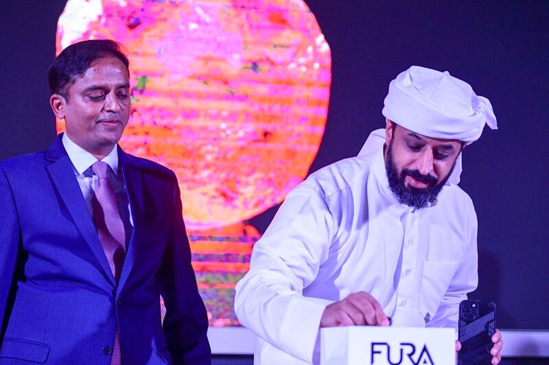 Ahmed bin Sulayem, executive chairman and chief executive of Dubai Multi Commodities Centre, right, and Dev Shetty, founder of Fura Gems, unveiled the Estrela de Fura ruby in Dubai.