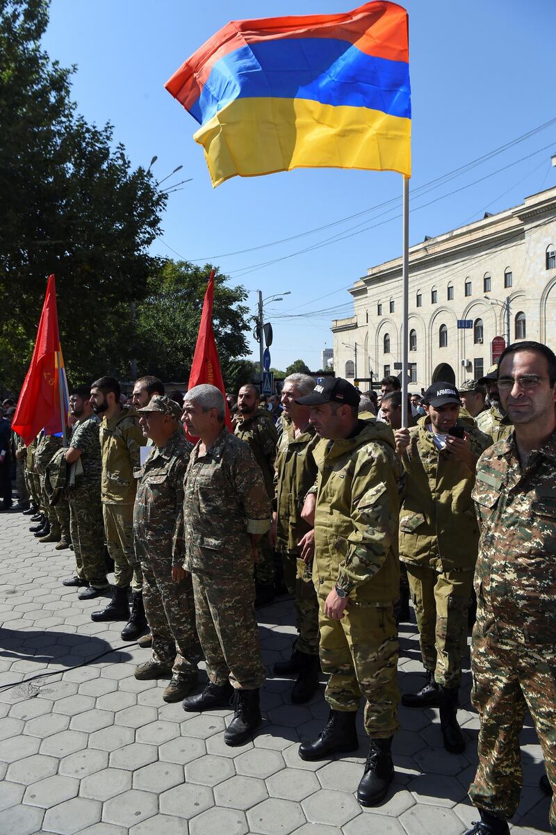 People attend a meeting to recruit military volunteers after Armenian authorities declared martial law and mobilised its male population following clashes with Azerbaijan over the breakaway Nagorno-Karabakh region in Yerevan, Armenia September 27, 2020. Melik Baghdasaryan/Photolure via REUTERS  ATTENTION EDITORS - THIS IMAGE HAS BEEN SUPPLIED BY A THIRD PARTY.