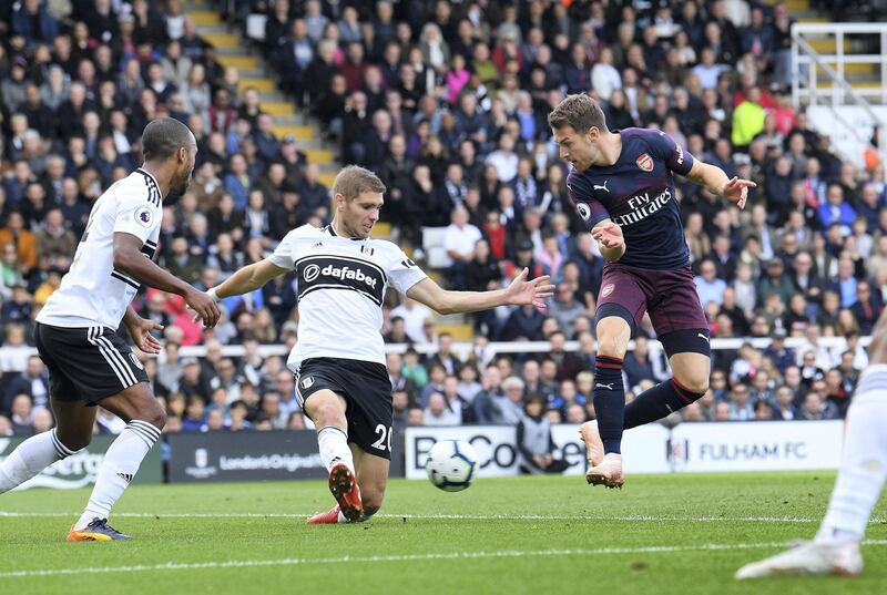 LONDON, ENGLAND - OCTOBER 07:  Aaron Ramsey scores Arsenal's 3rd goal under pressure from Maxime Le Marchard of Fulham during the Premier League match between Fulham FC and Arsenal FC at Craven Cottage on October 7, 2018 in London, United Kingdom.  (Photo by David Price/Arsenal FC via Getty Images)