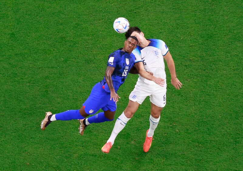USA's Haji Wright challenges Harry Maguire of England for a header. Reuters